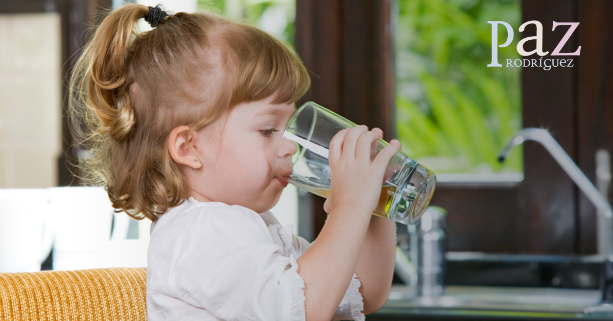 Young girl drinking water Young girl drinking water
